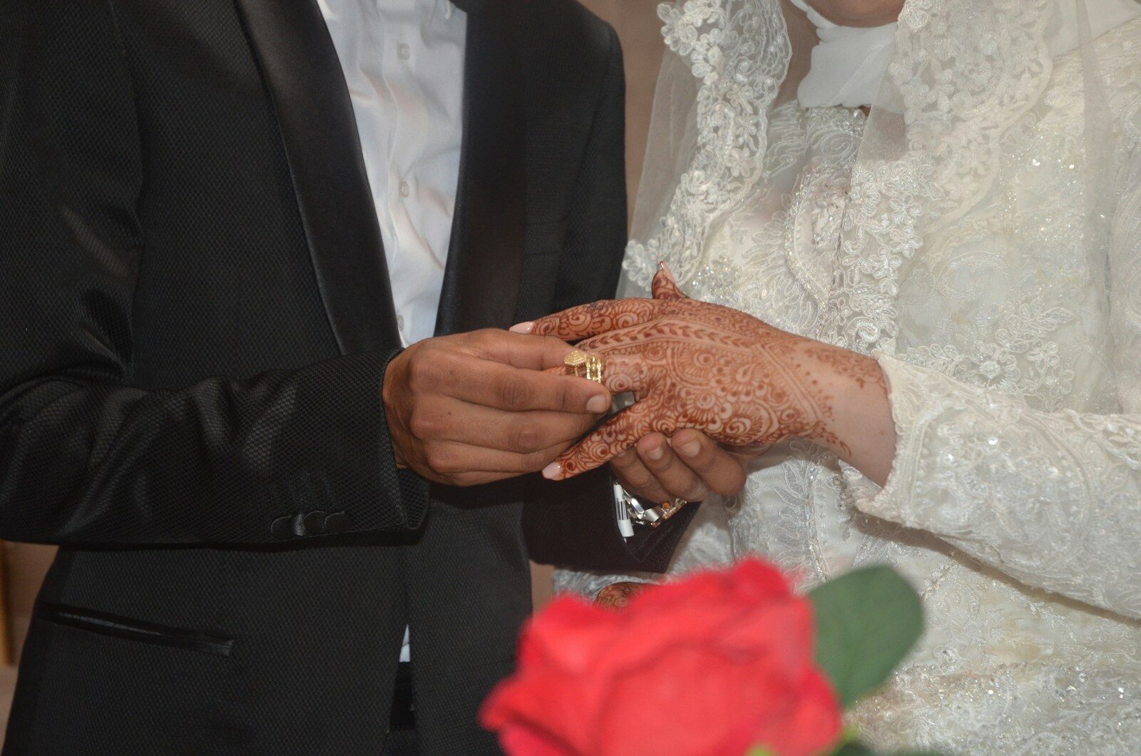 woman in white floral lace wedding dress